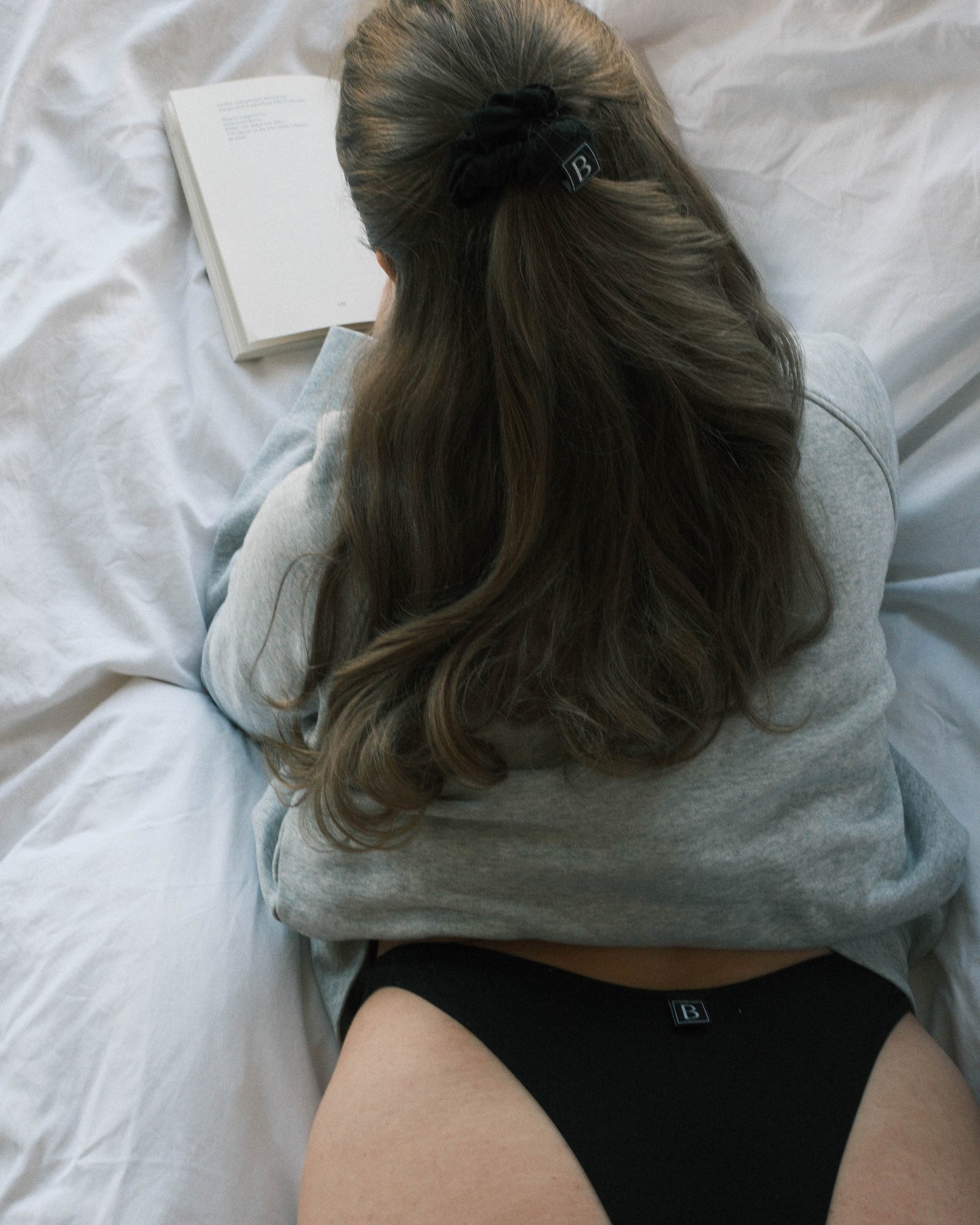 Day reading in buttery soft scrunchie and comfortable thong