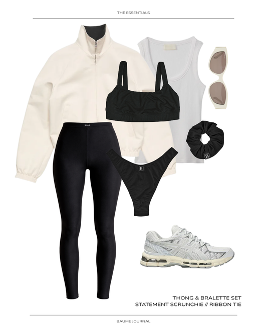 Neutral capsule outfit with black activewear set, white organic tank, sneakers, and minimal accessories arranged in a soft spring palette.