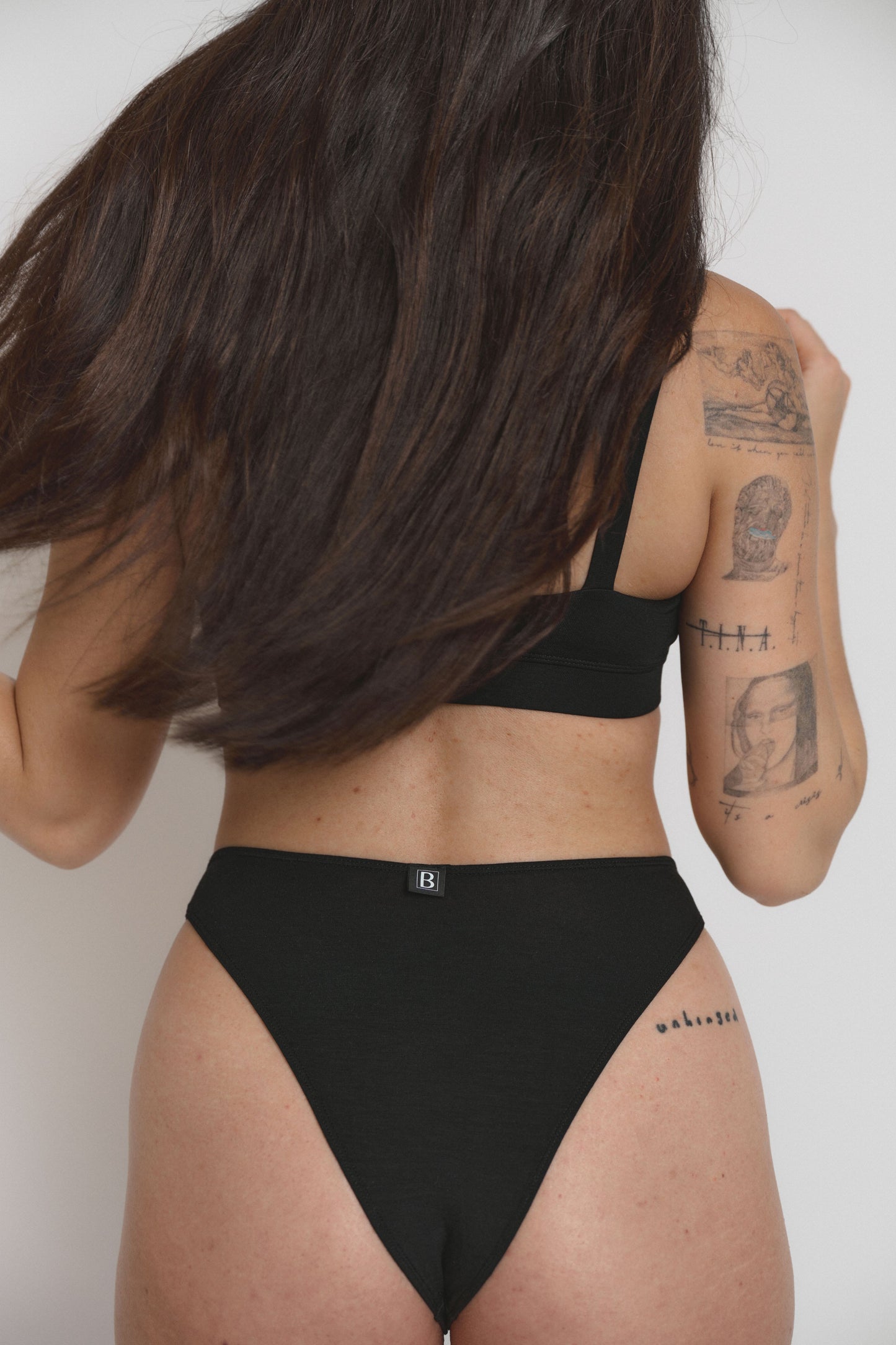 Model wearing high-cut pantie, back view