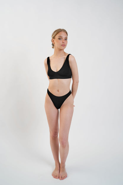 Model wearing light support Tencel™ Lyocell deep v bralette, front view
