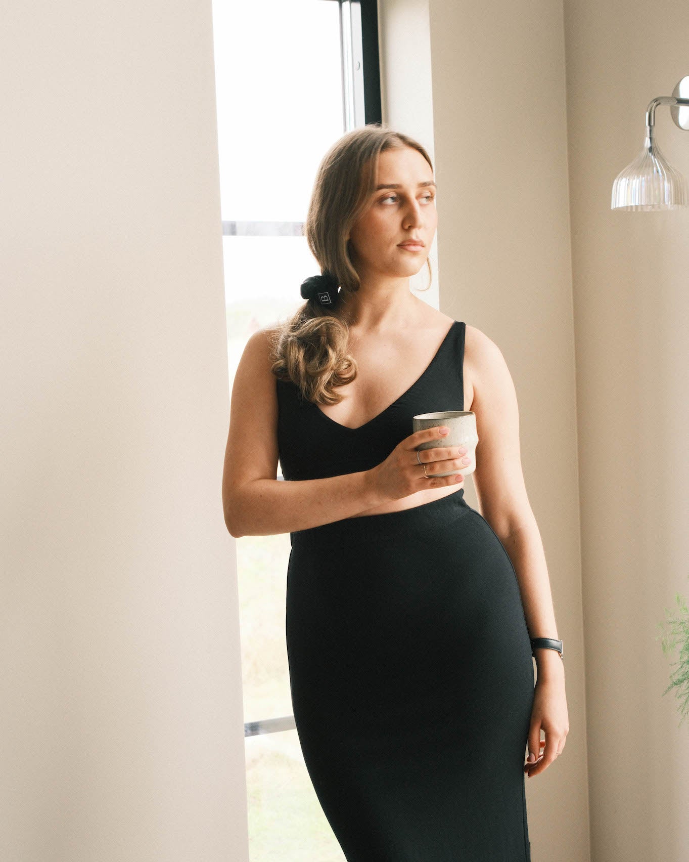 Model drinking coffee in sustainable tencel lyocell deep V bralette front