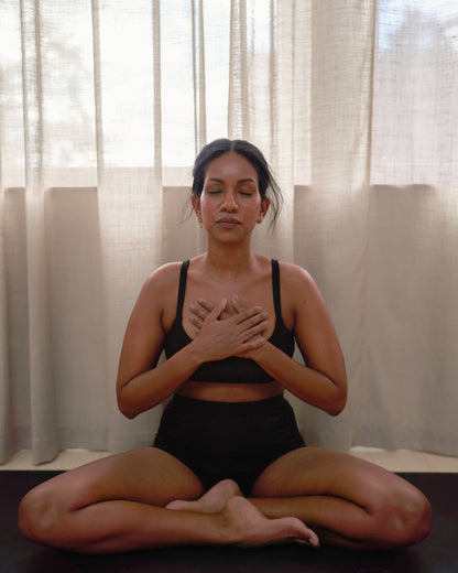 Yoga wearing high-waisted comfortable shorts, front view