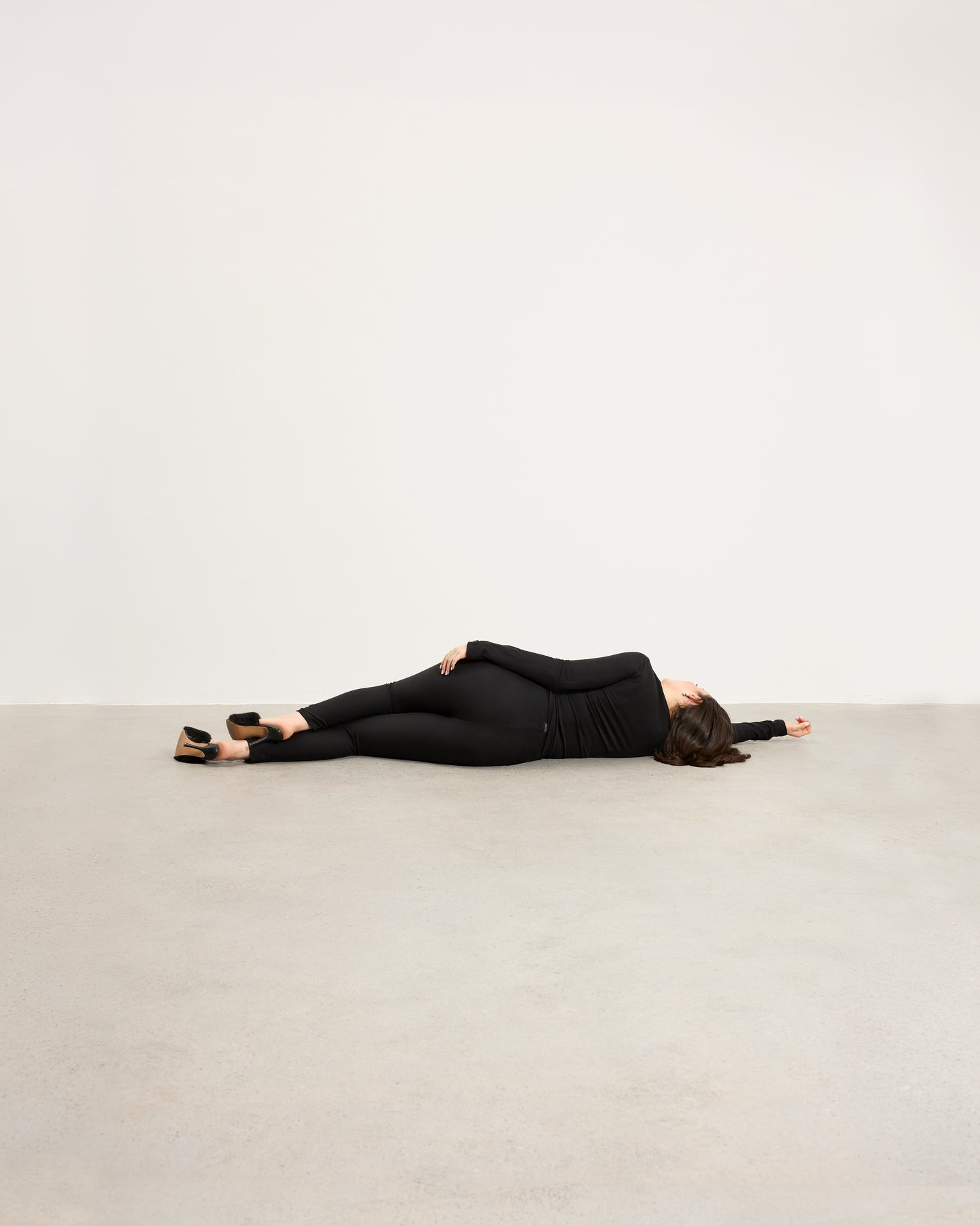 Model wearing Baume Essentials Atleisure long sleeve top and tights in TENCEL™ Lyocell, relaxed everyday loungewear.