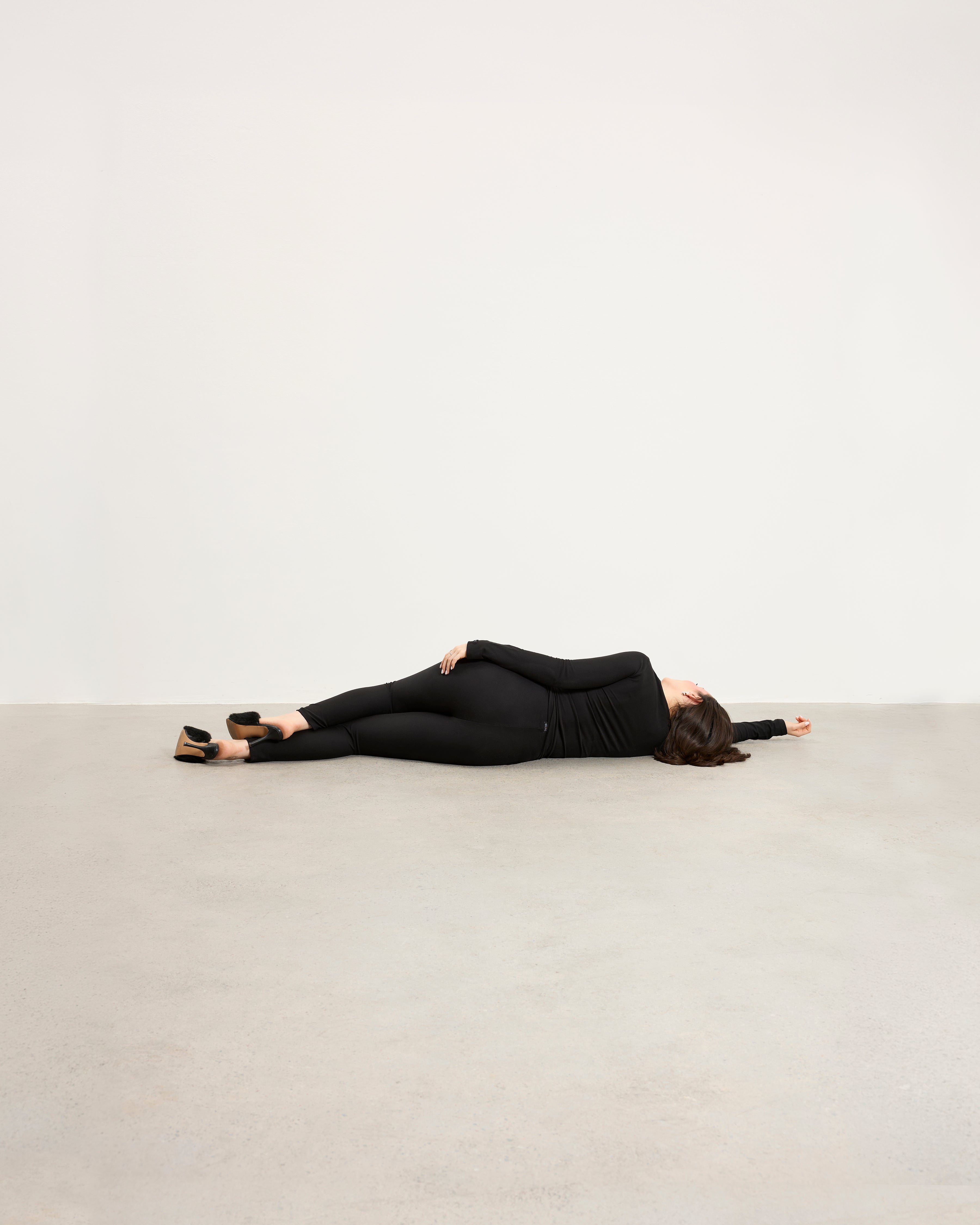 Model wearing Baume Essentials Atleisure long sleeve top and tights in TENCEL™ Lyocell, relaxed everyday loungewear.