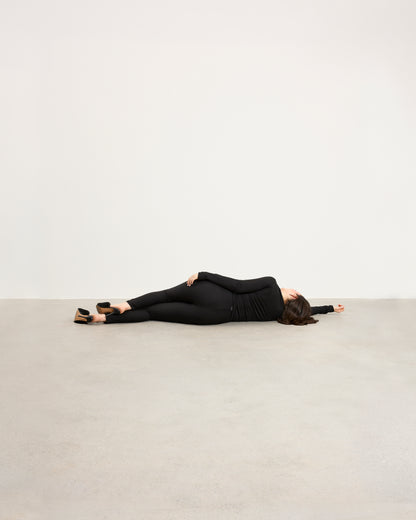 Model wearing Baume Essentials Atleisure long sleeve top and tights in TENCEL™ Lyocell, relaxed everyday loungewear.