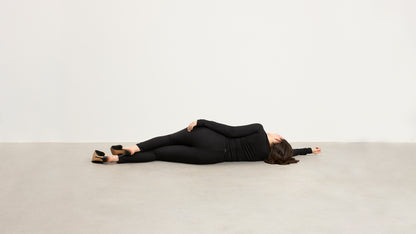 Model wearing Baume Essentials Atleisure long sleeve top and tights in TENCEL™ Lyocell, relaxed everyday loungewear.