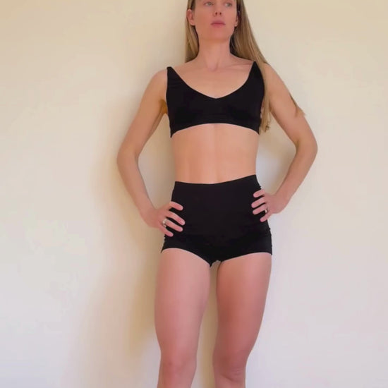 Co-founder Denise showcasing how to transform the versatile Deep V Bralette and Shorts from Baume Essentials to everyday statement pieces under a transparent dress. 