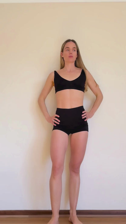 Co-founder Denise showcasing how to transform the versatile Deep V Bralette and Shorts from Baume Essentials to everyday statement pieces under a transparent dress. 