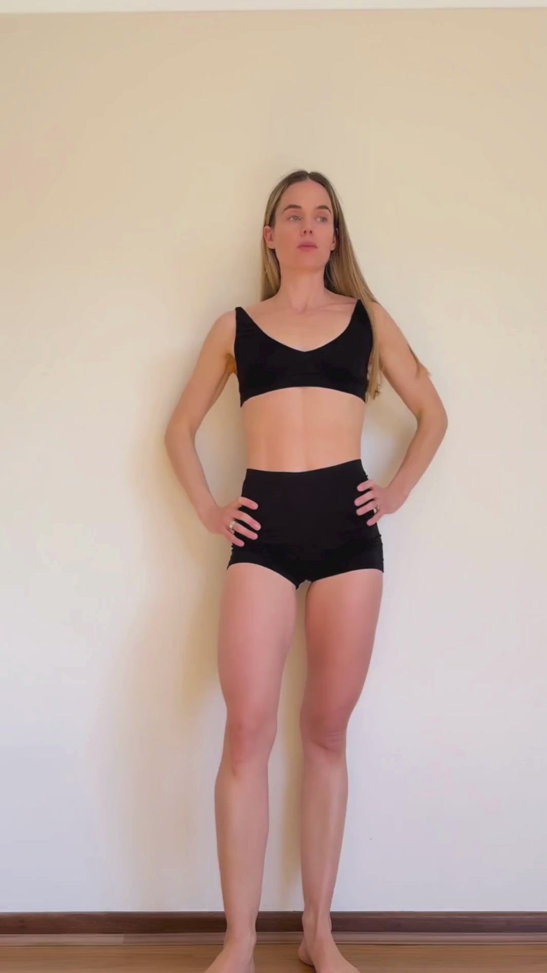 Co-founder Denise showcasing how to transform the versatile Deep V Bralette and Shorts from Baume Essentials to everyday statement pieces under a transparent dress. 