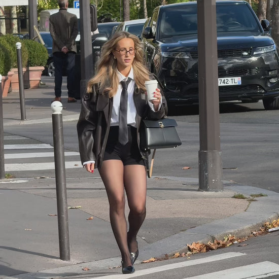 Baume Essentials everyday shorts showcased as part of an everyday outfit on the streets