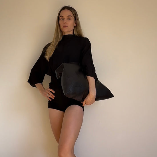 Co-founder Denise showcasing how to transform the versatile mii shorts from Baume Essentials to an everyday piece with a blouse and ballerina shoes. 