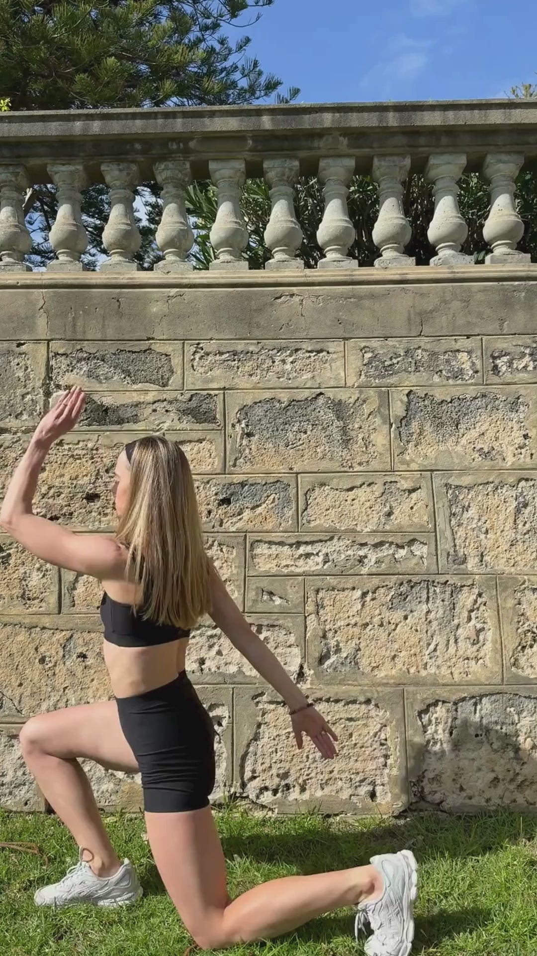 Woman exercising outdoors wearing the Baume Essentials Form Bralette and Form Shorts. Soft, breathable athleisure made from TENCEL™ Lyocell fibers with OEKO-TEX® certified materials. Comfortable everyday activewear designed for movement.